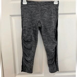 Lululemon cropped legging sheer side panel zippered pocket in back size 4